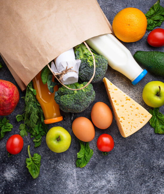 Fresh organic products in paper bag Fresh organic products in paper bag. Healthy shopping. Top view, copy space